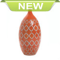 Gorgeous color, striking style, and timeless elegance! This beautiful decorative vase is etched with an exotic geometric pattern and finished with a vibrant orange glaze that will stand out on your table or mantel.