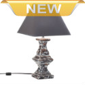 This lamp has a story to tell, and it starts and ends with stylish design! Its dramatic and architectural ceramic base is simultaneously modern and vintage with a unique weathered finish, and its topped by a rich fabric shade.