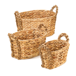 Classic and modern at the same time, this trio of woven nesting baskets features braided handles for timelessly chic storage. These oblong baskets are great for use in the kitchen, living room, craft room, and beyond!