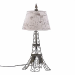 The metal wire frame mimics Paris most famous landmark, the Effiel Tower, fashioned in industrial-inspired metal with a vintage patina. The travel-stamped shade and French flourish on top make this lamp a continental charmer. Metal and hemp shade. 