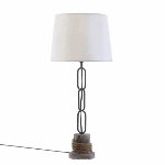 Add a nautical feel to any room with this maritime-inspired lamp. Long links of anchor chain stretch from a rope-wrapped pier pile to a crisp lampshade that mimics the color of whitecaps on the waves. 