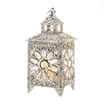 Live like royalty! Enjoy the sparkle of all the riches in the kingdom that are gathered in this stunning tabletop candle lantern. Faceted jewels set inside luxurious silver-tone filigree dazzle when a candle of your choice is lit inside. There’s nothing common about this enchanting treasure!