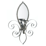 A little French flair that will reflect your dazzling eye for design! This is truly a unique and beautiful candle sconce, with an iron frame and mirrored back, that will make a stylish statement on your wall. Add the candle of your choice.