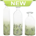 Decorate your space with butterflies! This beautiful apothecary-inspired glass bottle features charming butterflies, depicted as though they’re dancing on summer’s eternal breeze. The bottle features clear glass at the top that fades to a mossy green at the base to make the white butterflies stand out.