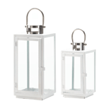 This contemporary lantern will make a bold statement indoors or out. The iron framework features fresh white paint, four clear glass panels, and a hinged door so you can easily fill it with the candle of your choice. It’s topped with a silvery finial and has a stylish hanging handle.