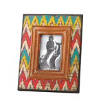 A fashionable frame in a timeless style! Show off your favorite photo memory in this stylish wooden frame that’s decorated with a colorful ikat chevron pattern. The design is aged to make it look like a timeworn treasure. 