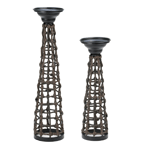 Equally rustic, tribal, antique and modern— this is a truly versatile candle stand that can work in any decor! The metal framework of this stand is wrapped in a knotted rattan style, creating a visually stunning and textural decor accent. The top pedestal is the perfect perch for the candle of your choice. Pair it with the small version for ultimate style!