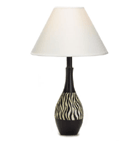 Striking stripes of black and white add adventurous appeal to this jug-shaped lamp, tastefully topped with a white fabric shade. Adds a wild little touch of Africa wherever it is placed