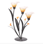 Gracious curves and warm amber glass add a strikingly sensual appeal to this three-tealight candleabra. Add the amber glow of candlelight to this elegant Art Nouveau sculpture for a truly stunning display! Iron with glass and acrylic accents. 