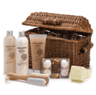 Every essential for a decadent at-home spa day is packed in this lovely lidded wicker basket! The rich, spicy scent of sandalwood adds natural appeal to moisturizing salon quality lotions, scrubs and bath crystals, all expressly collected for your ultimate delight. Set includes: 9.1 fl. oz. body lotion and cream bath, 5.0 fl. oz. body scrub, 2 bar soaps, 4 fizzers, wooden pumice nail brush, and willow basket.