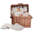 Spoil yourself! Cute wicker chest contains bath items in a relaxing 'Honey Vanilla' scent, comfy slippers and a massage tool. 