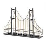 A candlelit accessory and a conversation starter, all in one! This charming candle holder features six fluted clear glass candle cups set on the framework of a suspension bridge. Metal posts, golden wires, and beaded details make this a lighting accent that is your room’s bridge to style!