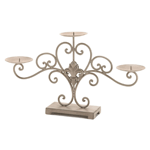 Decorate your home with a little French flair and a whole lot of candlelight with this beautiful stand. The scrolling metal curls are embellished with a stylized fleur de lis symbol in the center and hold three candle platforms that are ready for the pillar candles of your choice. 