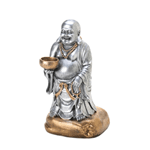 The soft glow from a single candle will illuminate this happy Buddha statue and add tranquility to your room. Hes finished in shimmering silver with bronzed accents, and the candle bowl he holds awaits the tealight candle of your choice. Candle not included.