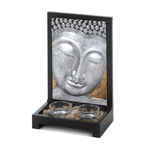 Creating a space thats equal parts calming and gorgeous is easy with this beautiful candle holder. The wood frame holds two clear glass tealight candle cups surrounded by polished stones, and the standing plaque features an artistic Buddha face finished in gleaming silver. Tealight candles not included.