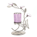 Candlelight never looked so dreamy! This beautiful silver candle stand features a cutout butterfly fluttering past delicate pink flowers, while the glass candle cup shimmers with its pink finish and butterfly motif. Candle not included. 