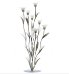 Slender silver spires and leaves surround delicate frosted lily blooms; lovely by day, and enchanting when crowned with candlelight. An art-house treasure in the classic Art Deco tradition!