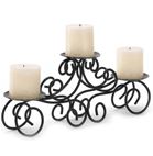 For instant decorating magic, look no further than this curvy candle stand! Elegantly fashioned from wrought iron scrolls, this triple-candle decoration make a gracious focal point atop your mantle, table or shelf. Spike bottoms.