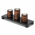 The light from three tealights will dance off the 3D carvings of these candleholders to make the elephant family come to life as they perch atop their wooden platform.