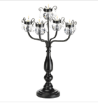 Tall, elegant candleholder gets its glamor from a crown of glittering crystals! Dozens of facets capture dancing candlelight to create an ever-changing show of dazzling rainbows. Breathtakingly beautiful!