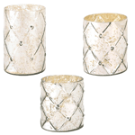 Make a style statement in your home with this small, medium or large mercury glass candle holder. The quilted pattern and silvery shimmer will dance with glamorous glow when you light the candle of your choice inside! Mercury Glass.