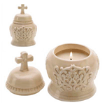 Beautiful embossed design is a lovely theme for this quietly elegant ceramic decoration, reminiscent of a peaceful cathedral piece. Beneath the cross-topped lid, a wood-amber scented candle creates a serene golden glimmer when set aglow! 4.5 oz. Burns up to 25 hours.