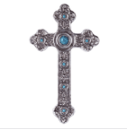 The look of silver and turquoise are brought together to impressive effect in this handsomely carved wall cross.