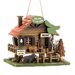 Let the call of the wild welcome birds into your yard with this adorable log cabin birdhouse. Fashioned after a vacation rental in the heart of the wilderness, it features rustic accents, including a moose head sign, rope fencing, and a cute black bear cub on the prowl for a snack.