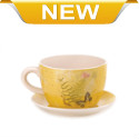 Set your favorite plant in this charming teacup planter that will bring sunny charm to your day. The warm yellow exterior design features travel stamps and postcard notes along with fern fronds and a pretty butterfly. Drain hole at bottom of teacup. 