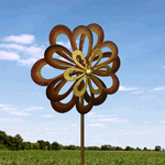 Iron petals twirl and spin in the breeze, performing a delightful dance in your yard or garden. This seven-foot-tall windmill features three rows of petals that spin in the wind.