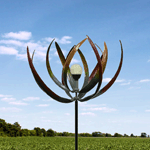 A work of art powered by the sun and by the breeze! This stunning windmill stands 7 feet tall and features long leaves that will twirl and spin in the wind around a solar-powered bulb. 