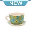 Strut your green thumb and show off your favorite potted plant in this charming teacup planter. Royal turquoise and vivid peacock feathers on both the cup and saucer will make your favorite blooms look even more fantastic. Drain hole at bottom of teacup. 2 separate pieces. 