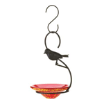 Expect happy guests to fly in for the feast served in this lovely hand-blown glass bowl feeder. Striking perfect harmony between the strength of the metal framework and the delicate beauty of the red and yellow glass serving dish, this feeder’s molded metal bird motif will encourage all of your feathered friends to flock when you fill it with their favorite seeds and feed.