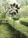 A double-sided windmill for twice the garden delight! When the wind blows, both sides of this metal windmill are set in motion, one clockwise and the other counterclockwise, adding mesmerizing beauty and a touch of whimsy to your yard. It features a metal stake for ease of placement.