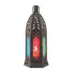 Vibrant colors dance when a candle is lit inside this handsome tabletop candle lantern. Rich, jewel-tone hues come to life with the brightly colored and patterned glass panels framed by the intricate design of the dark metal lantern frame. Brighten your home with exotic flair!