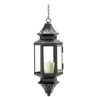 Dancing shadows and golden illumination form a fascinating display, filling the night with mellow candlelight. Styled after the lanterns found throughout the ancient Eastern lands, this pierced-metal pendant lamp brings an exotic dash of faraway mystery to your very own backyard. Metal with glass.