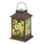 When lit from within, the stained glass panels of this stylish lantern come alive with jewel-like colors, turning captured sunlight into a mesmerizing display. No candles or electricity required; solar-power cells in the lid recharge automatically when outdoors! 