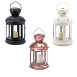 Cutouts and glass windows gleam with reflected candlelight in this colonial-style metal candle lamps. In Bronze, Black, or White.