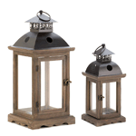 This candle lantern has tons of rustic charm packed into its compact design. The wooden frame has a weathered finish and an antiqued latch on the hinged door. Topped with a decorative metal roof and hanging loop, all it needs is the candle of your choice!