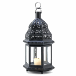 Starlight patterns glow from each cutout of this ornate metalwork candle lantern! Traditional Moroccan styling adds a classic exotic look to any garden setting.