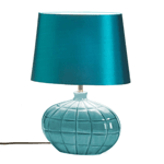 This fearless table lamps mixes the rustic texture of hand glazed ceramic with the luxurious sheen of a silken shade. The depth of color in the shapely base is echoed in the vibrant teal shade that will illuminate your room with distinguished style.