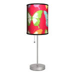 Bright colors and dazzling light will fill your room when you pull the stainless steel cord of this lamp. The slim design makes it a perfect fit for any table or desk, and the butterfly-adorned shade is cheery and charming. Made in USA. Wipe clean with dry cloth. 13W light bulb not included. 