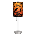 Black birds, silhouetted at sunset, give this little lamp a big style impact! The sleek shape of the stainless steel base give this lamp the ability to fit just about anywhere you need extra light. The dramatic design of the shade lets you punch up the glowing style of your room simply by pulling the stainless steel cord. 