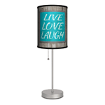 Remember lifes most important lessons: Live, Love, Laugh! This charming table lamp features a shade with a weathered wood background and a teal sign that will make you smile each time you see it. The lamps slim design lets you put it anywhere you need a little light and a little reminder to live life to the fullest. Made in USA.