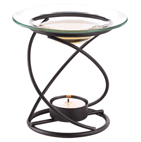 A graceful spiral base supports a clear glass oil dish, along with a warming tealight below. Just add a few drops of fragrant oil for a gently scented glow!