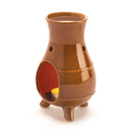 An ode to old-world ovens with mixed matte and gloss terracotta finish and southwestern design, this ceramic oil warmer is a pleasing sight as it fills your room with a pleasing scent. The opening in the side welcomes at tealight candle, while the reservoir at the top accepts fragrant oil; light the candle and enjoy!