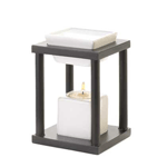 Dark metal contrasted by pale geometric porcelain basins, this oil warmer speaks volumes to visitors about your exquisite taste in fine design. Add your favorite scented oil and candle, and then bask in the sleek and stylish ambiance it creates.