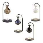 With a generous dollop of charm, these striking oil warmers will mesmerize you with its simple elegance. A metal loop balances the ceramic oil basin above a seated tealight to give off a warm glow and delicate scent.