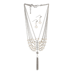 Sparkle and shine with vintage style! This gorgeous set features a multilayered necklace with shimmering crystals and a silvery tassel, along with matching crystal drop earrings.