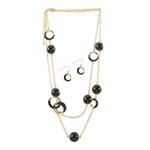 Put a sleek spin on your outfit with this dramatic Black Orbit Jewelry Set. The necklaces golden chain is decorated with a series of black orbs and the matching dangling earrings make the prefect complement to your style.